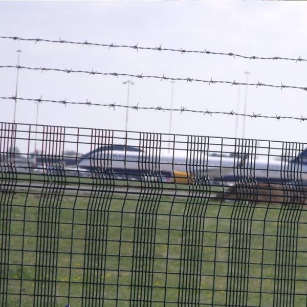 Three lines of barbed wires are installed on the top of airport fence