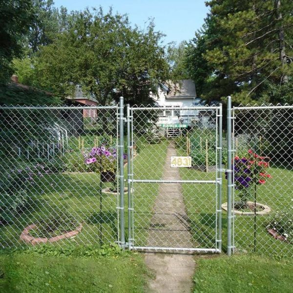 A piece of chain link single swing gate are installed in the garden