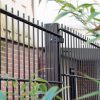 Black double wire fence is installed outside the building