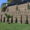 Welded gabions are installed as the exterior wall of the house